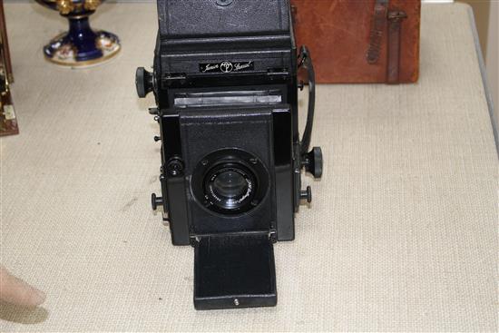 A Pickard Junior Special quarter plate camera with J H Dallmeyer lens, Anastigmat lens, height when closed 17cm, depth when closed 13cm